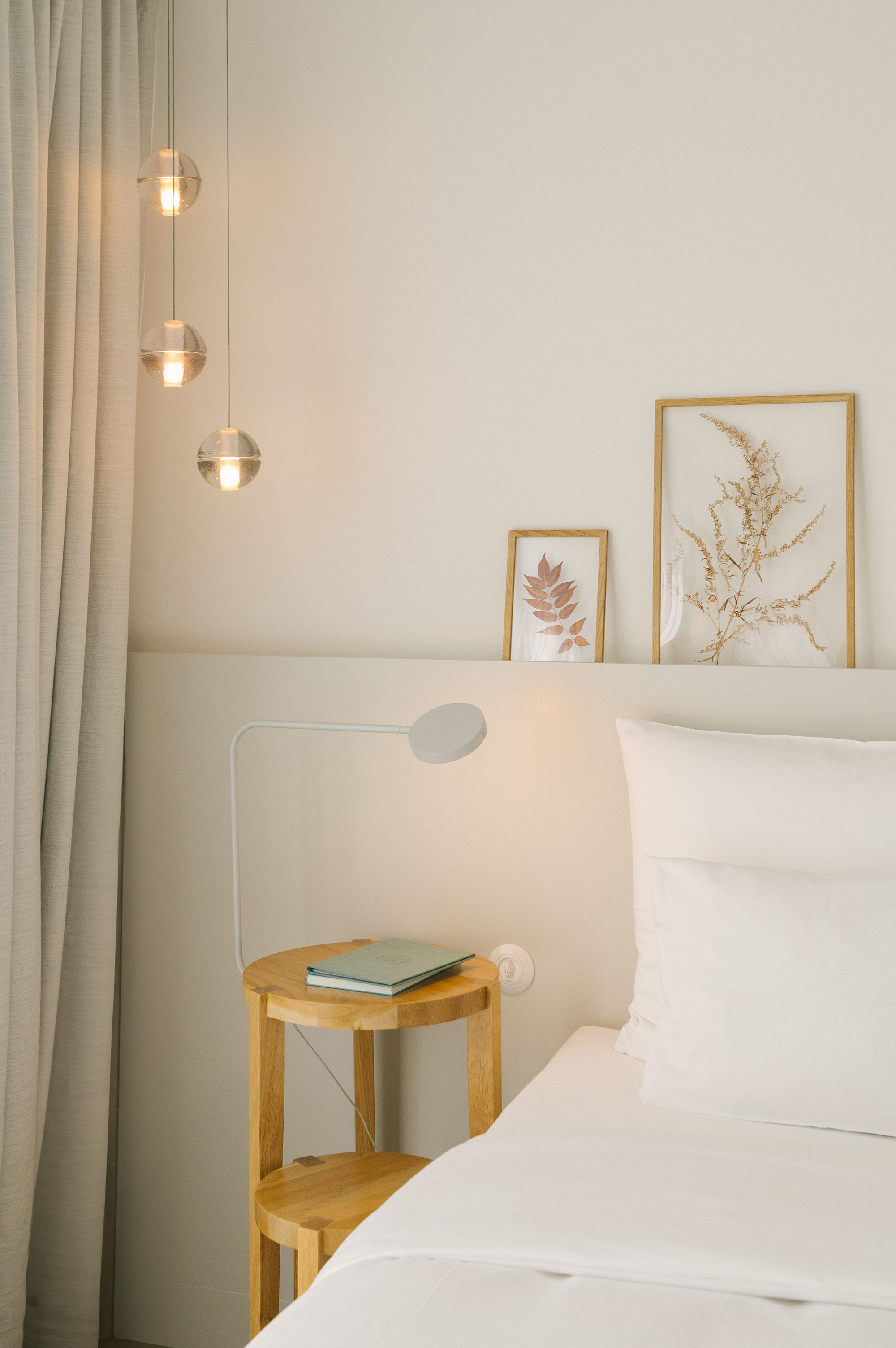 A restrained approach to the guest room: light natural tones, wood and understated lighting define the interior of a penthouse room at Wilmina.